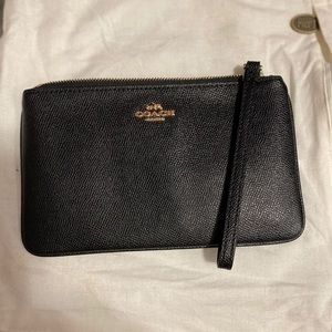 Coach black pebble wristlet with gold hardware